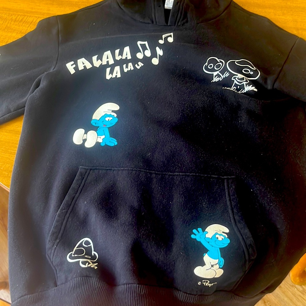 this is a hoodie i’m really good shape. it’s a medium and has Smurf’s all over